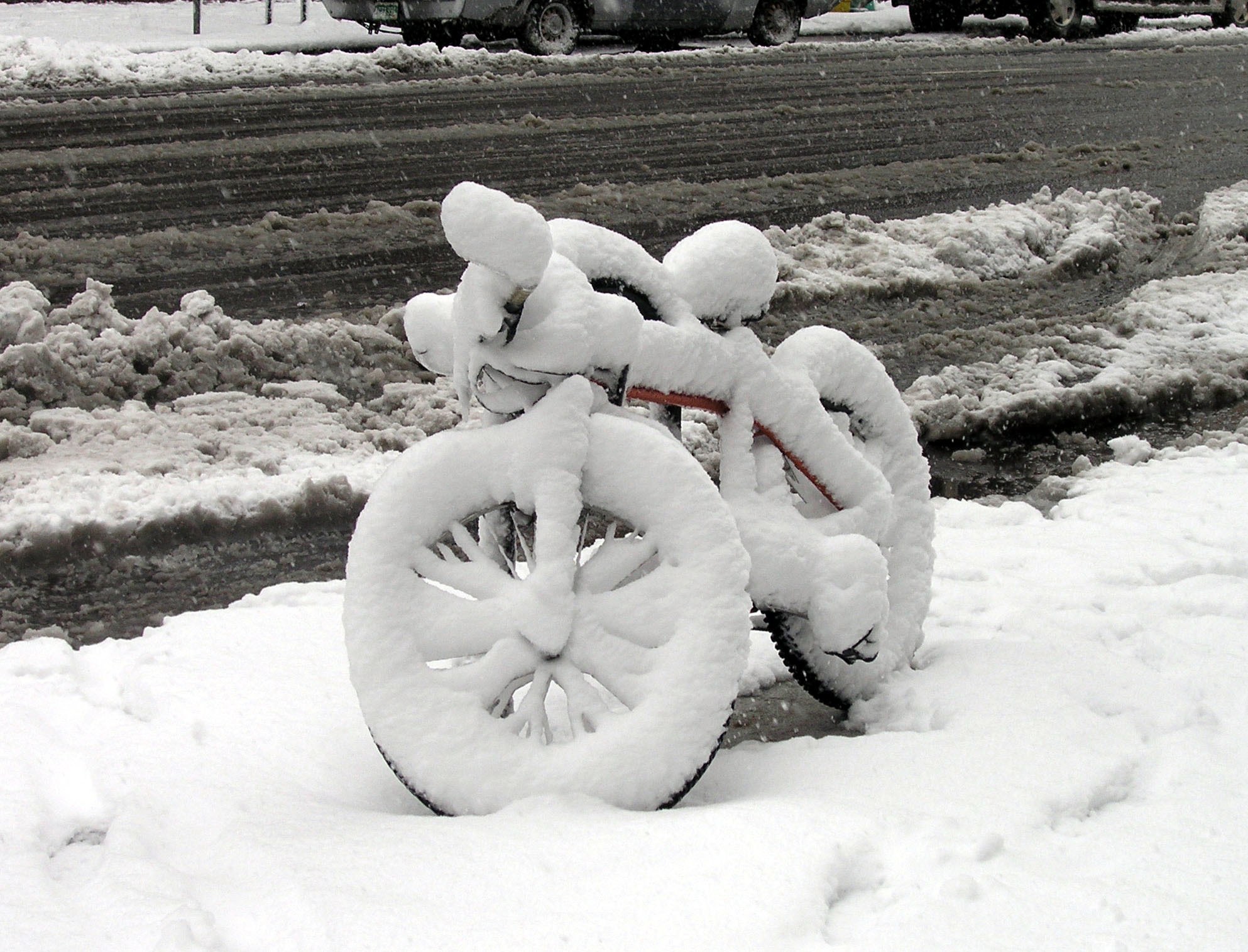 Bicycle buried in snow