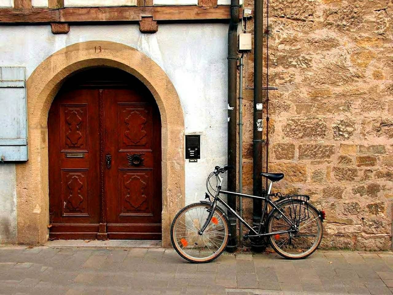 Bicycle by a historic door