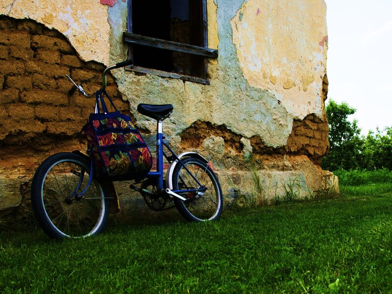 Bicycle by a weathered wall