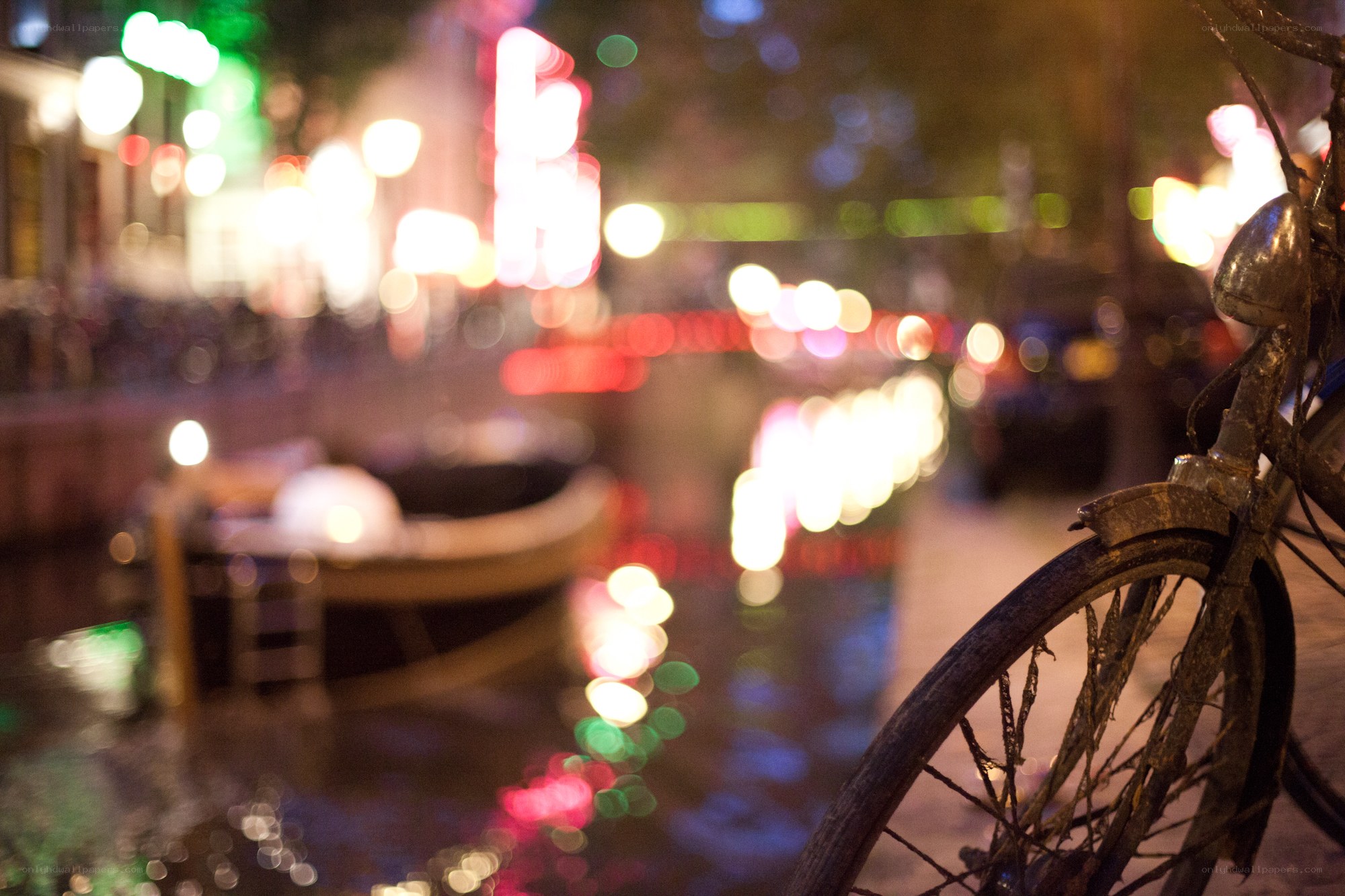 Bicycle by canal at night