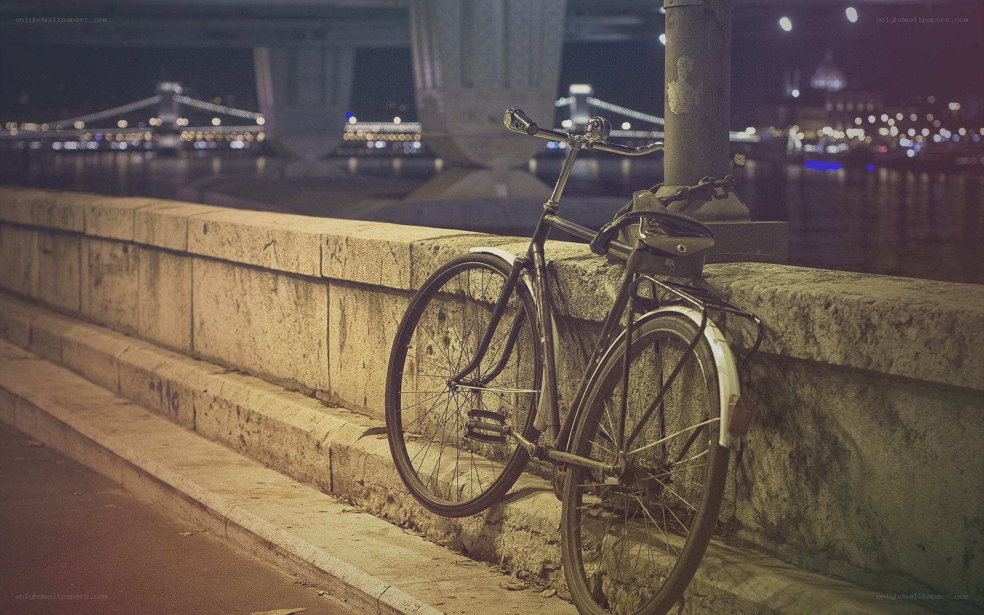 Bicycle by the river at night