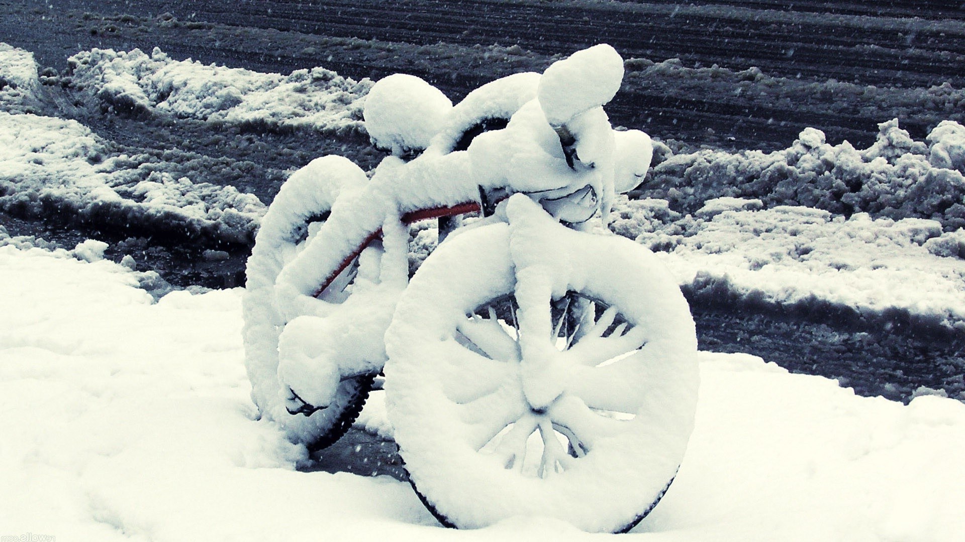 Bicycle covered in snow
