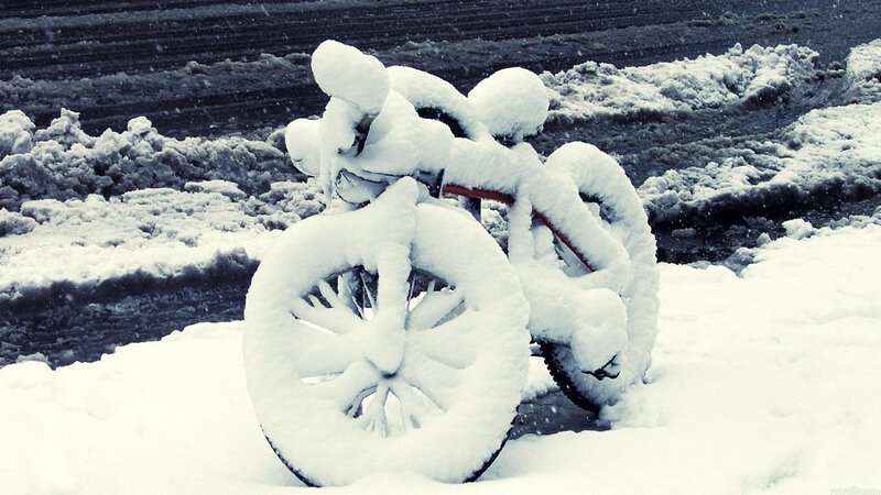 Bicycle covered in snow
