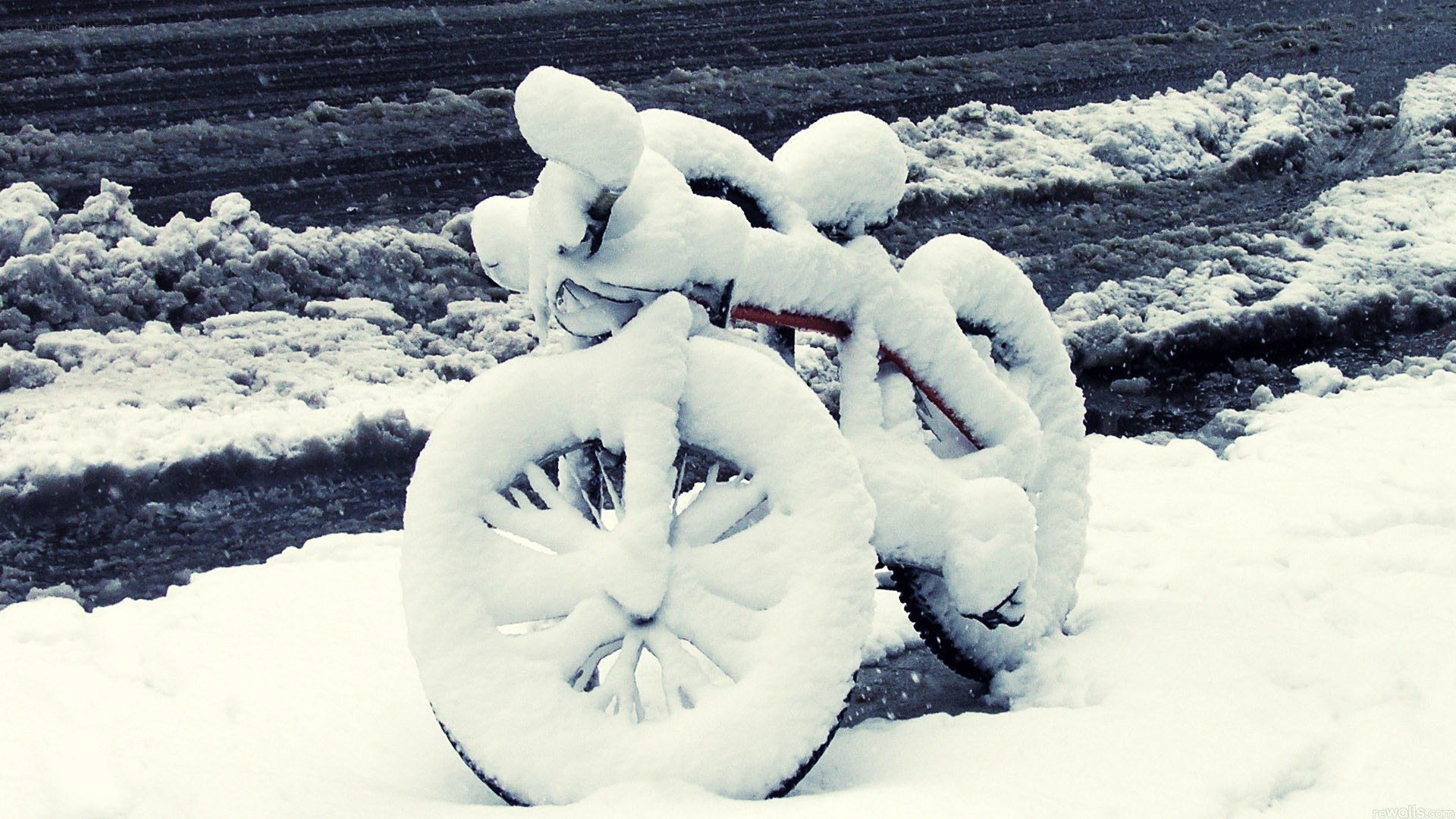 Bicycle covered in snow