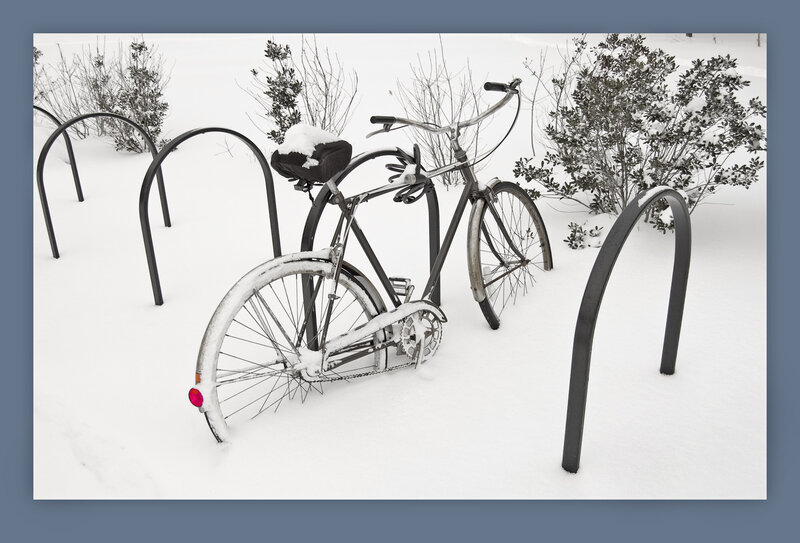 Bicycle in snowy bike rack
