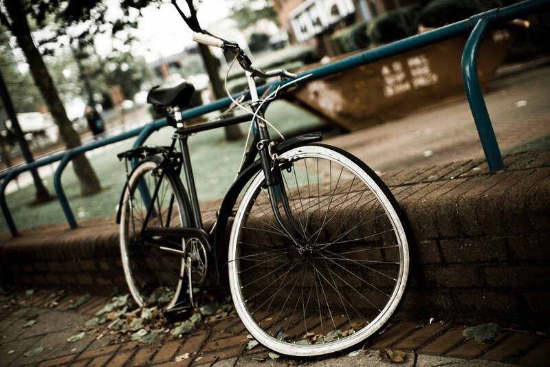 Bicycle leaning against a railing