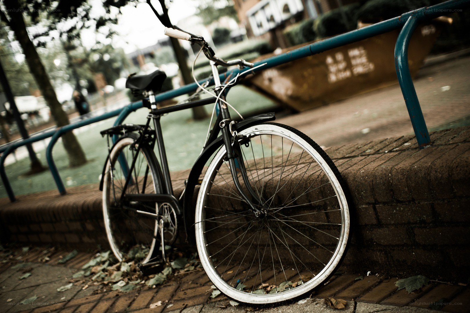 Bicycle leaning against a railing