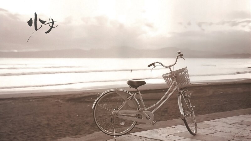 Bicycle on a beach at sunset