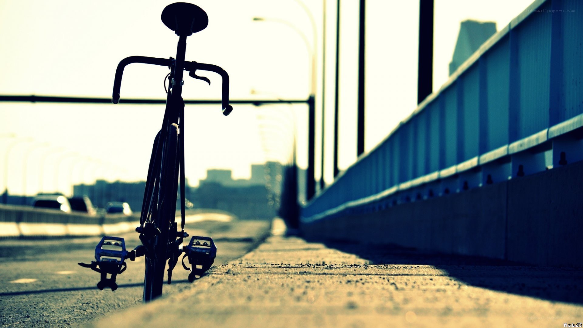 Bicycle on a bridge at sunset