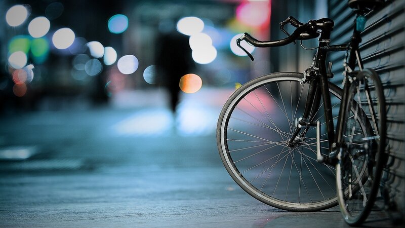 Bicycle on a city street at night