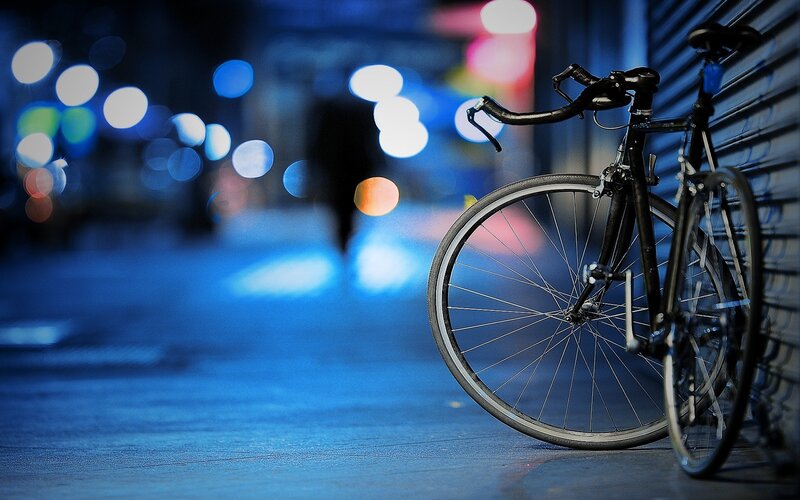 Bicycle on a city street at night