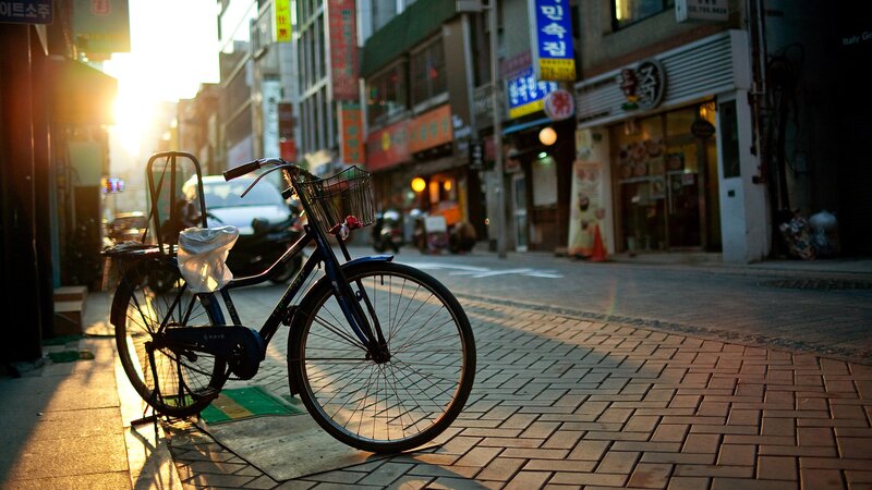 Bicycle on a city street at sunset