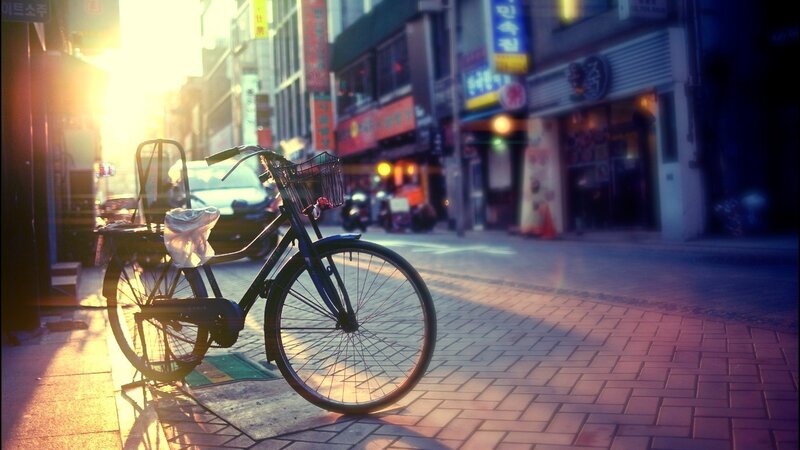 Bicycle on a city street at sunset