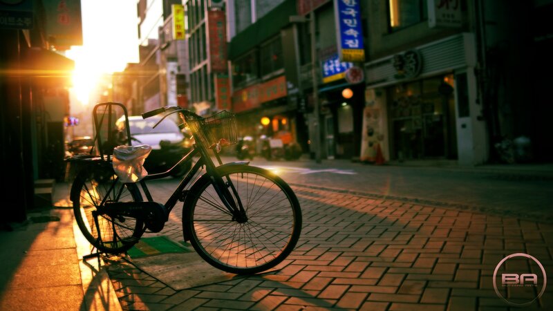 Bicycle on a city street at sunset