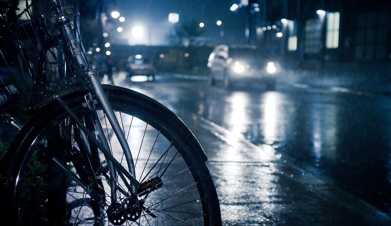 Bicycle on a rainy street at night