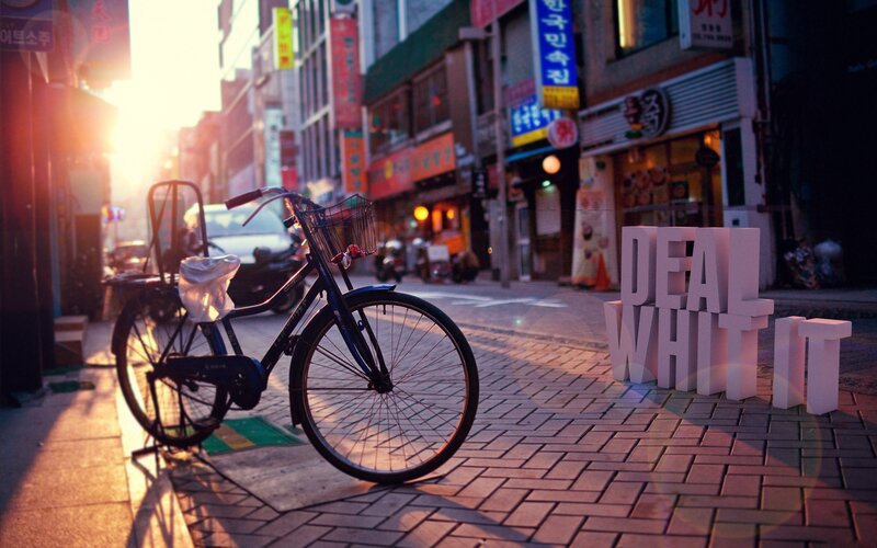 Bicycle on City Street — Orange
