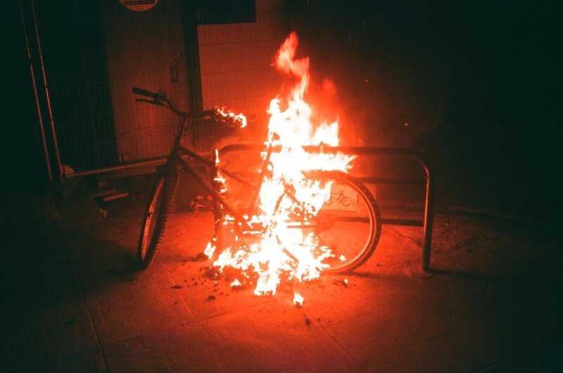 Bicycle on fire at night
