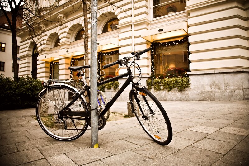 Bicycle parked on city sidewalk