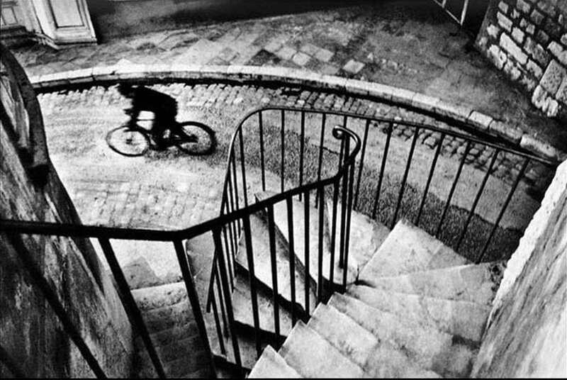 Bicycle rider on cobblestone street