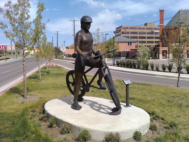 Bicycle rider statue in park