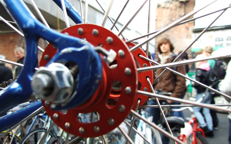 bicycle wheel in a crowd