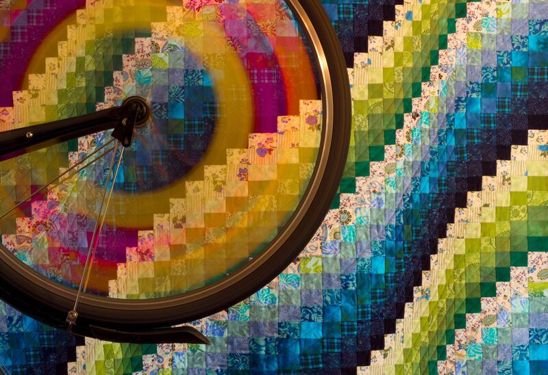 Bicycle Wheel on Quilt