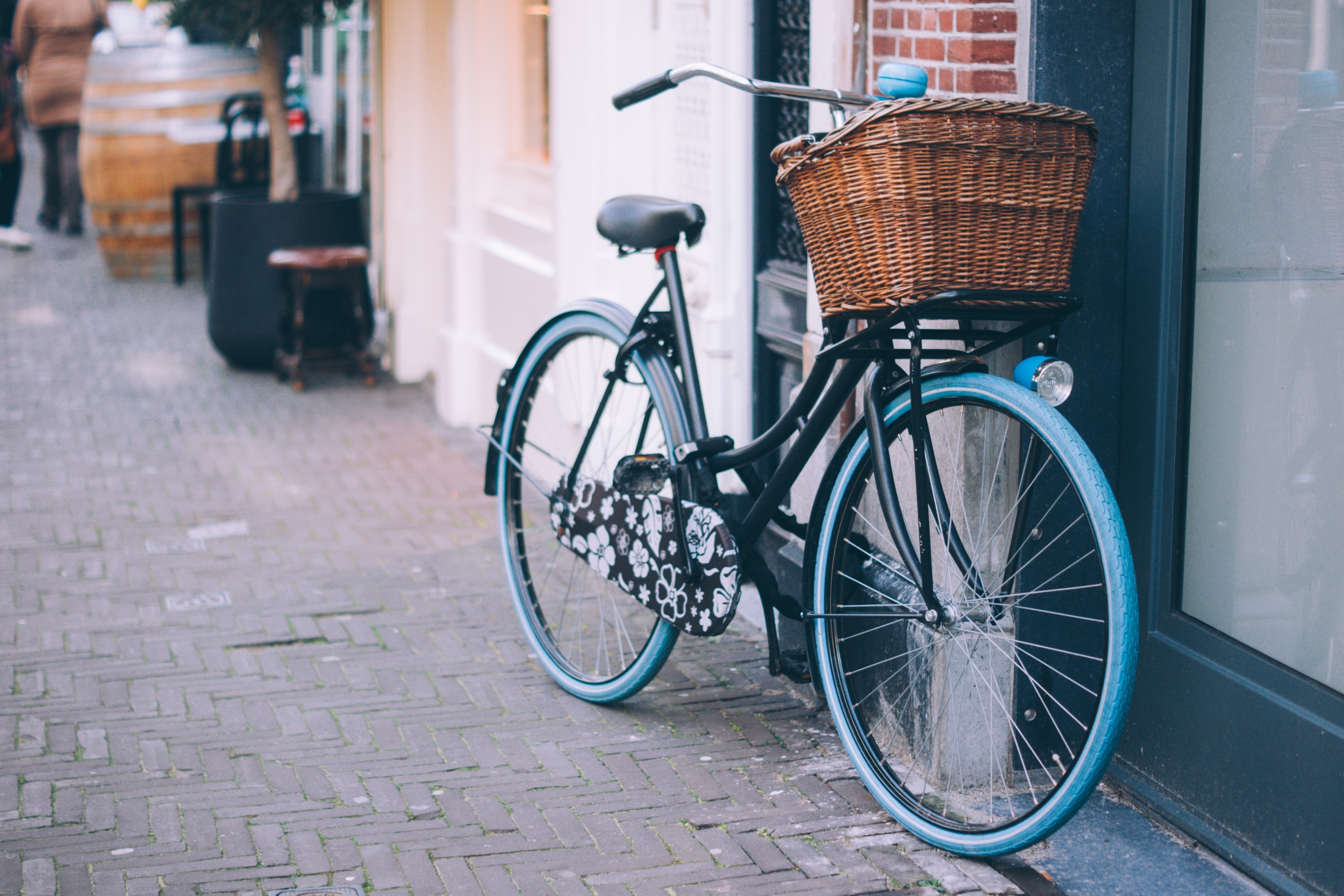 Bicycle with basket on sidewalk