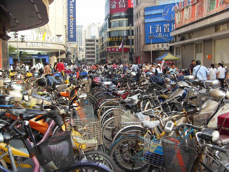 Bicycles and scooters in a busy city