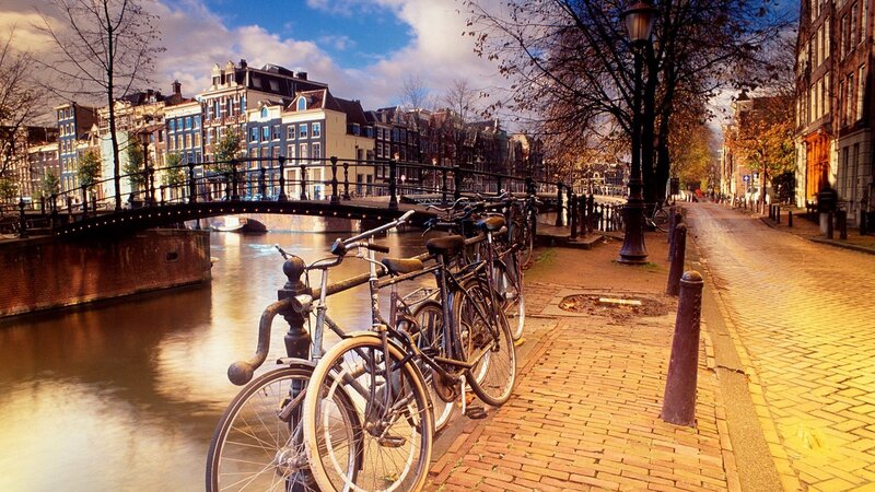 Bicycles by a canal in Amsterdam