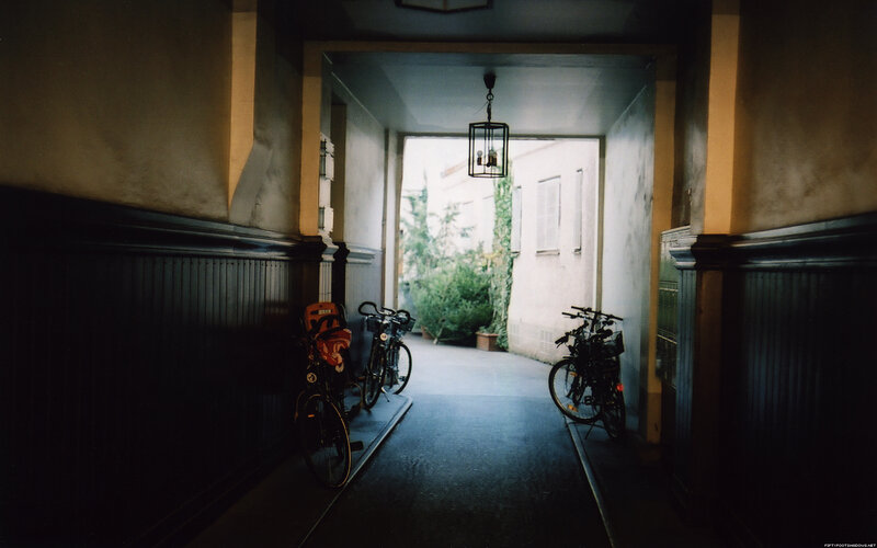 Bicycles in a dimly lit hallway