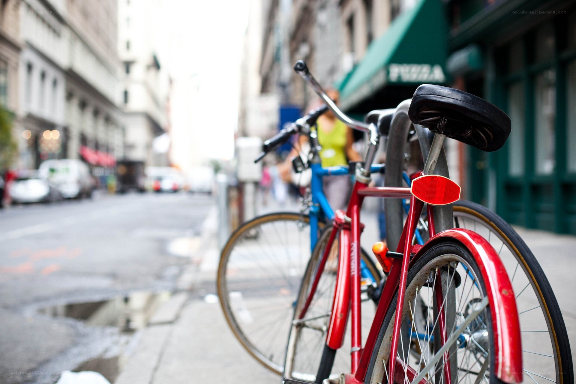 Bicycles parked on city sidewalk