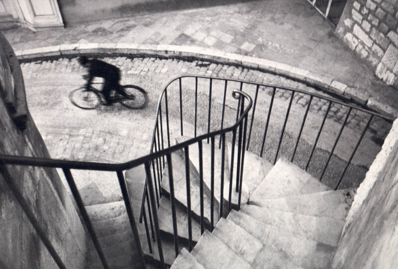 Bicyclist on a cobblestone street