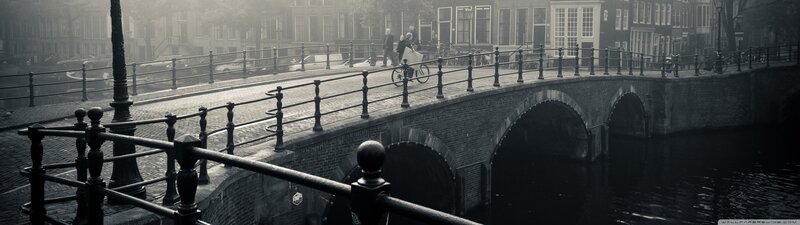 Bicyclist on Canal Bridge