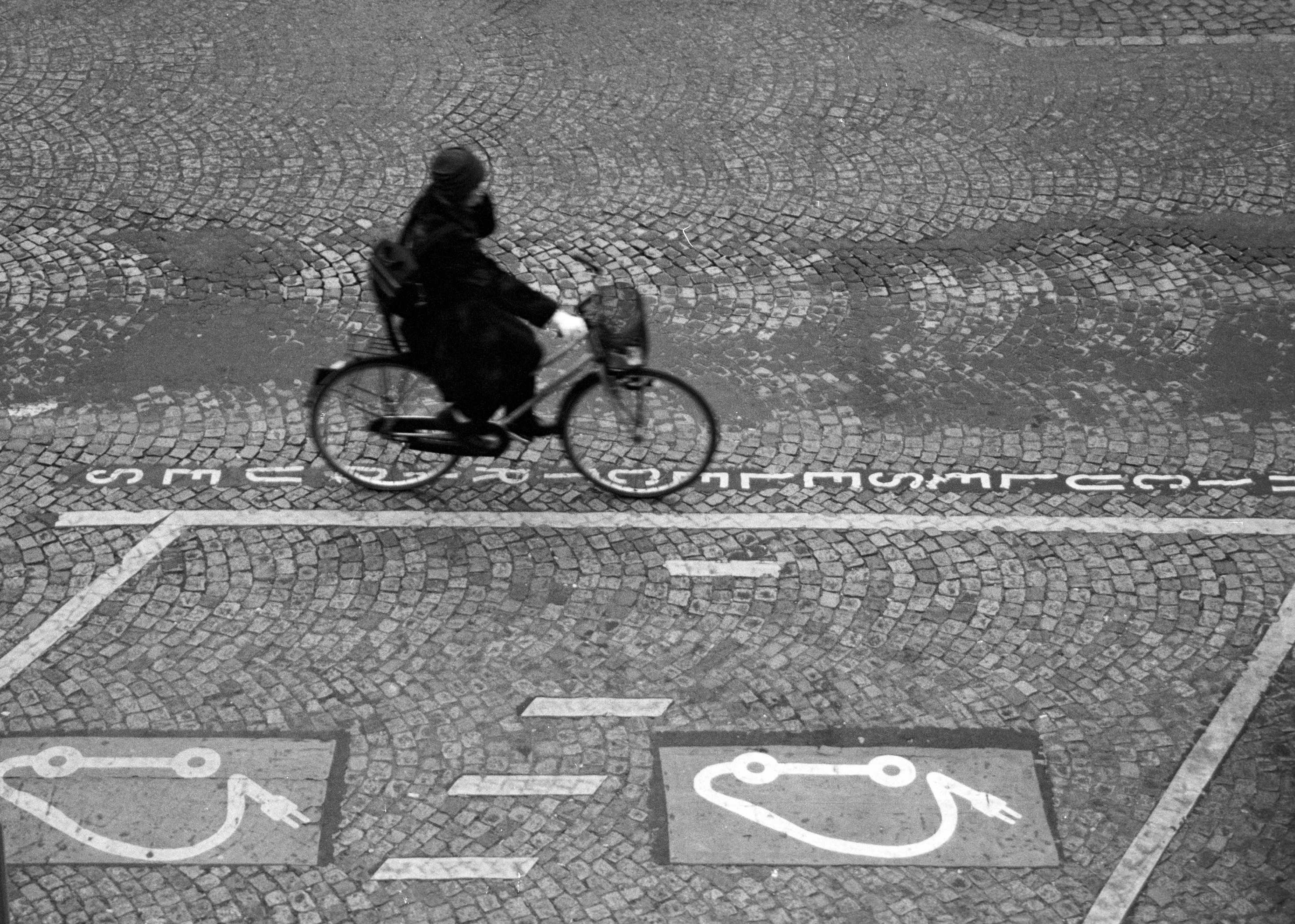 Bicyclist on cobblestone street