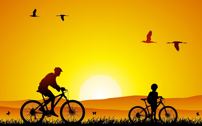 Bicyclists at sunset