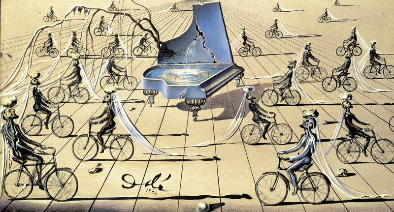 Bicyclists with a broken piano