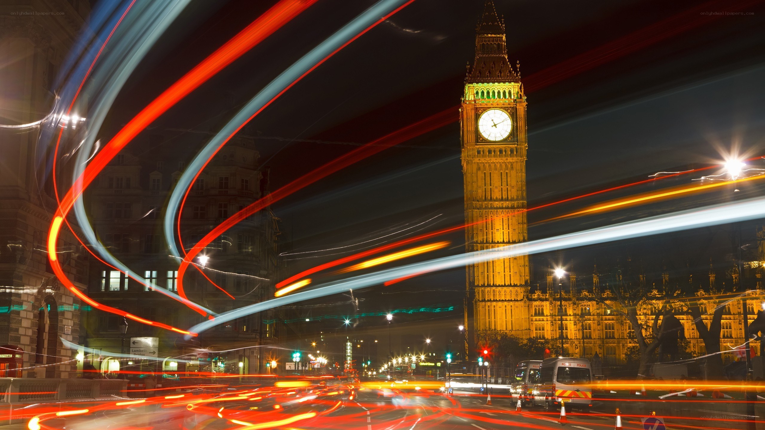 Big Ben at night with light trails