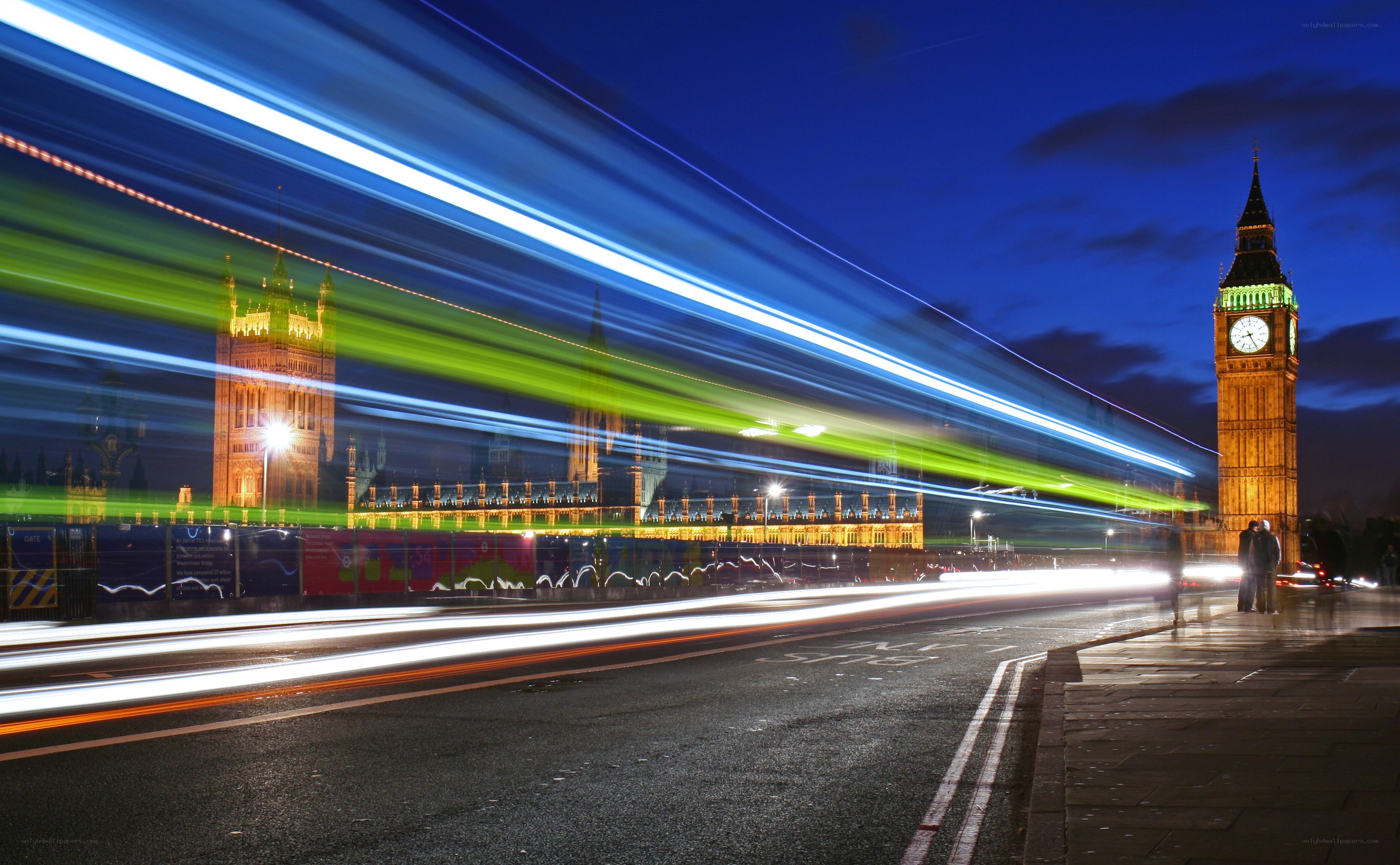 Big Ben at night with light trails