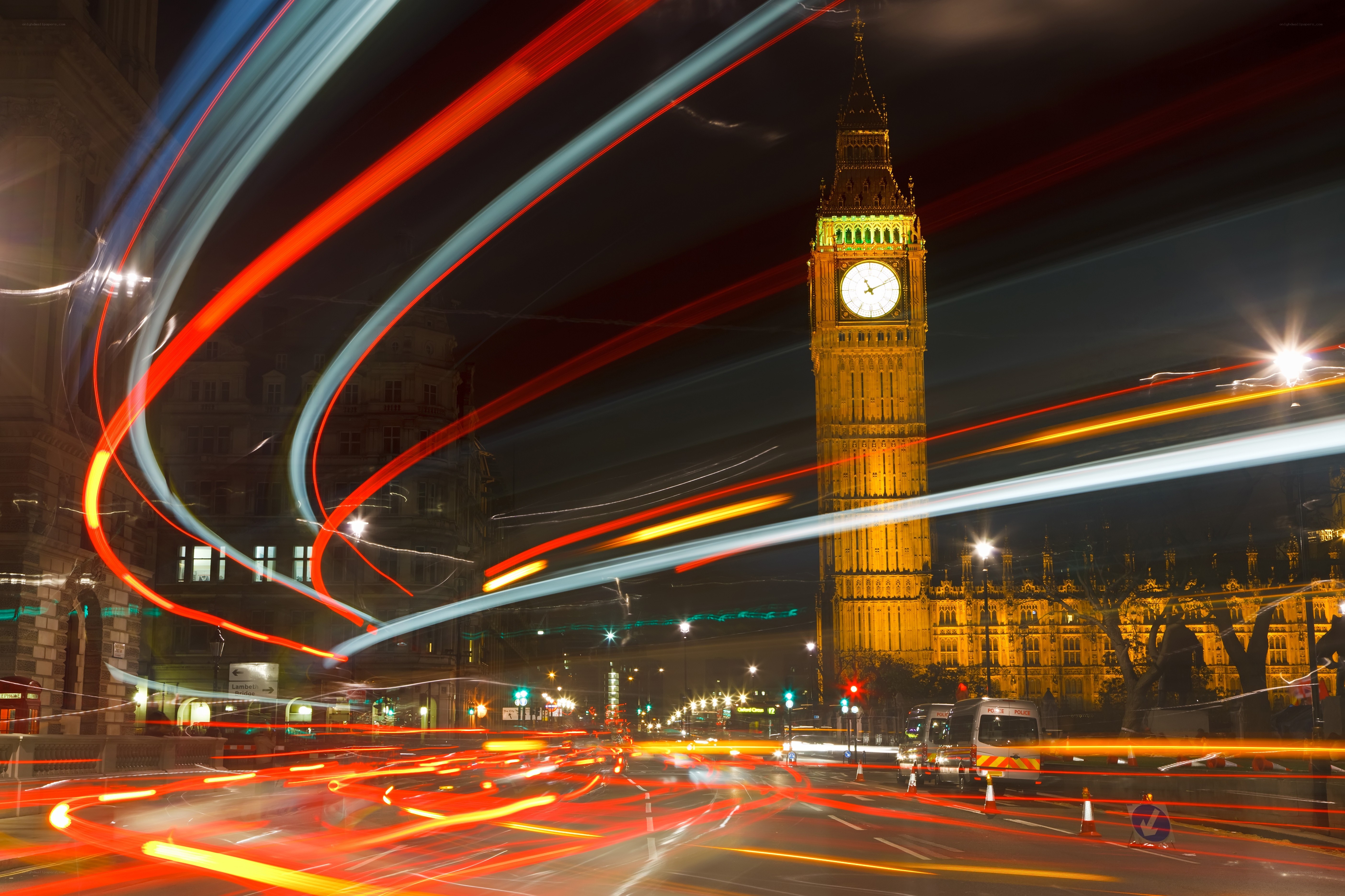 Big Ben at night with light trails