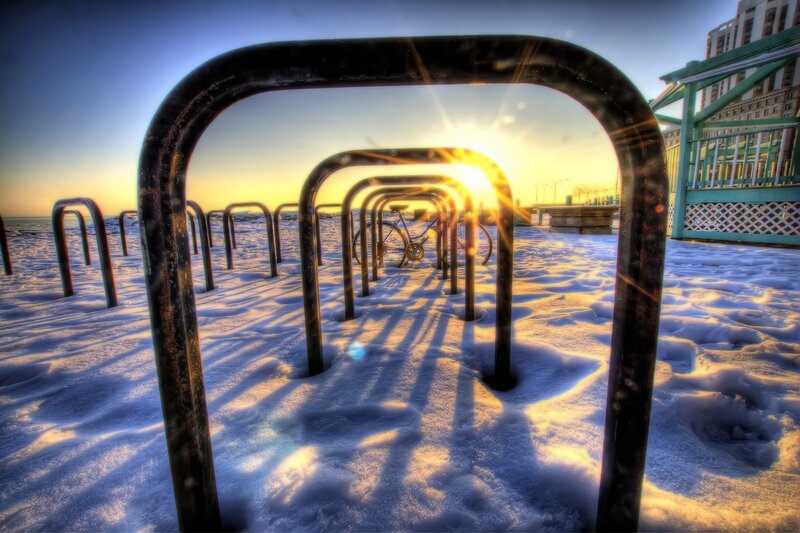 Bike racks at sunset in snow