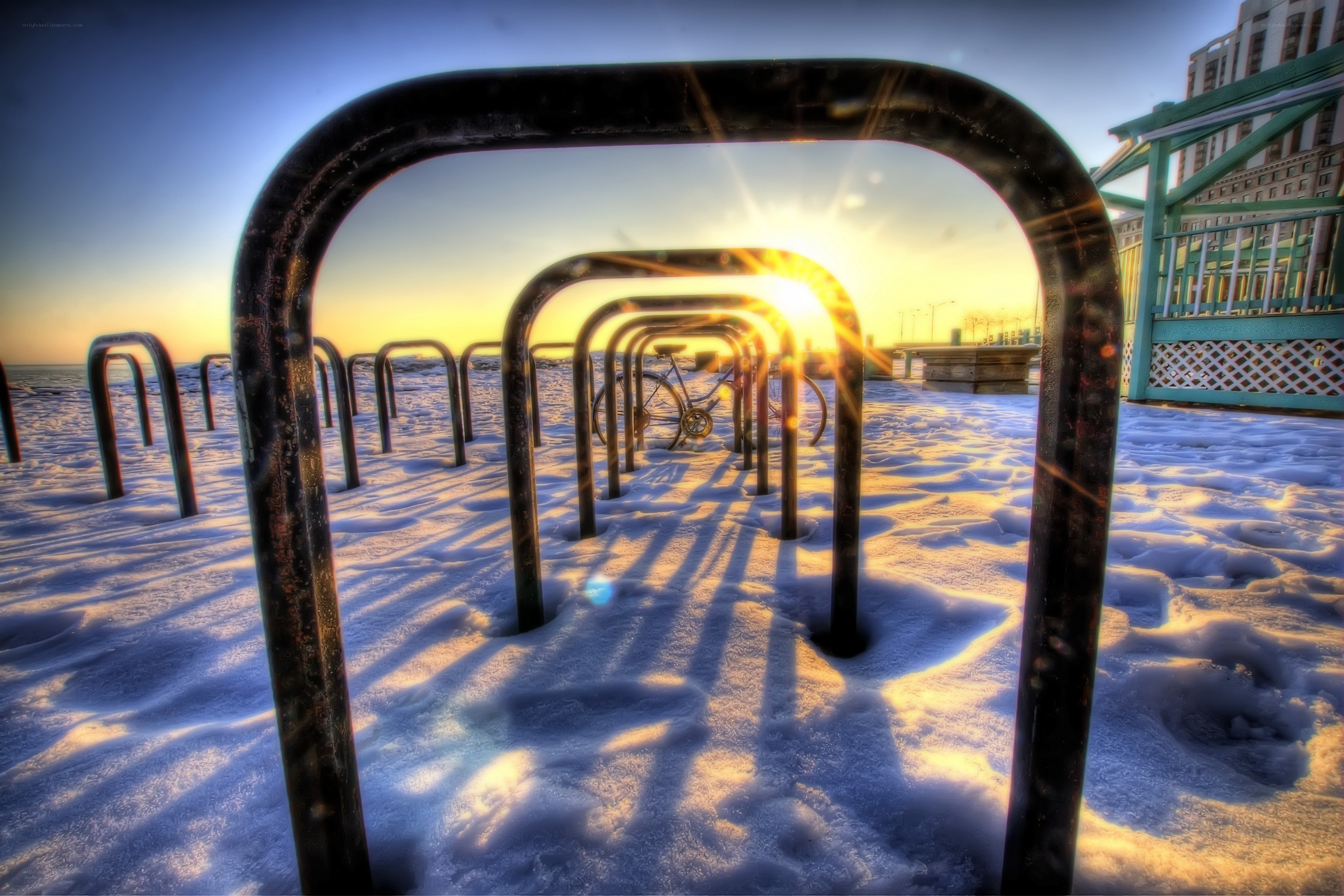 Bike racks at sunset in snow