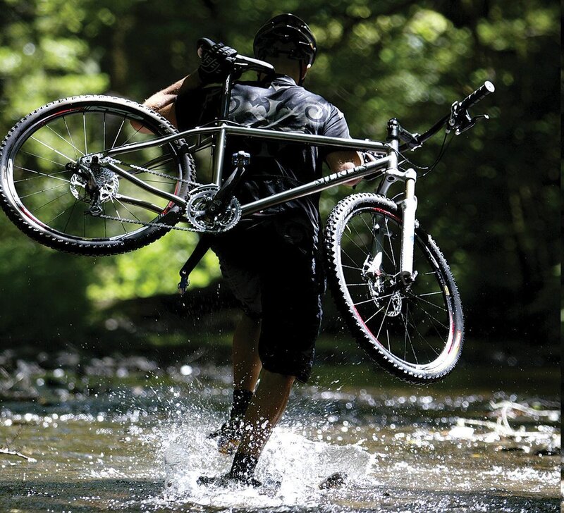 Biker crossing a stream