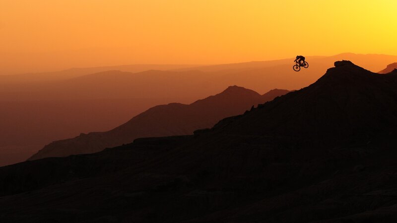 Biker in Mid-air — Orange, Dramatic