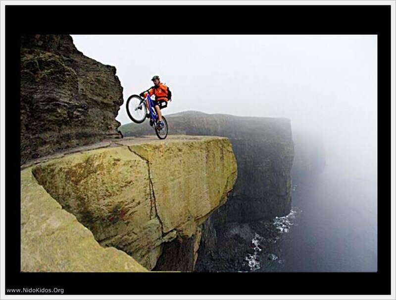 Biker on a cliff edge