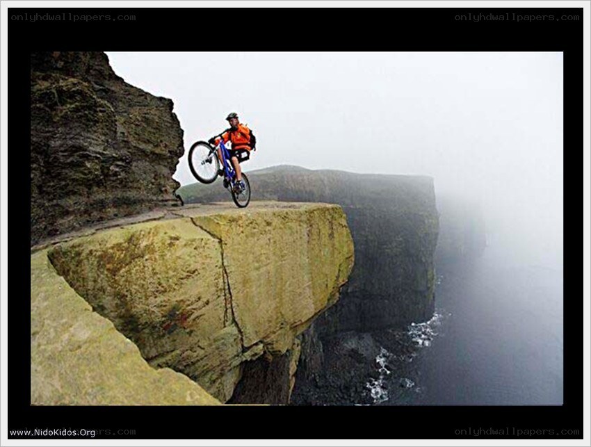 Biker on a cliff edge