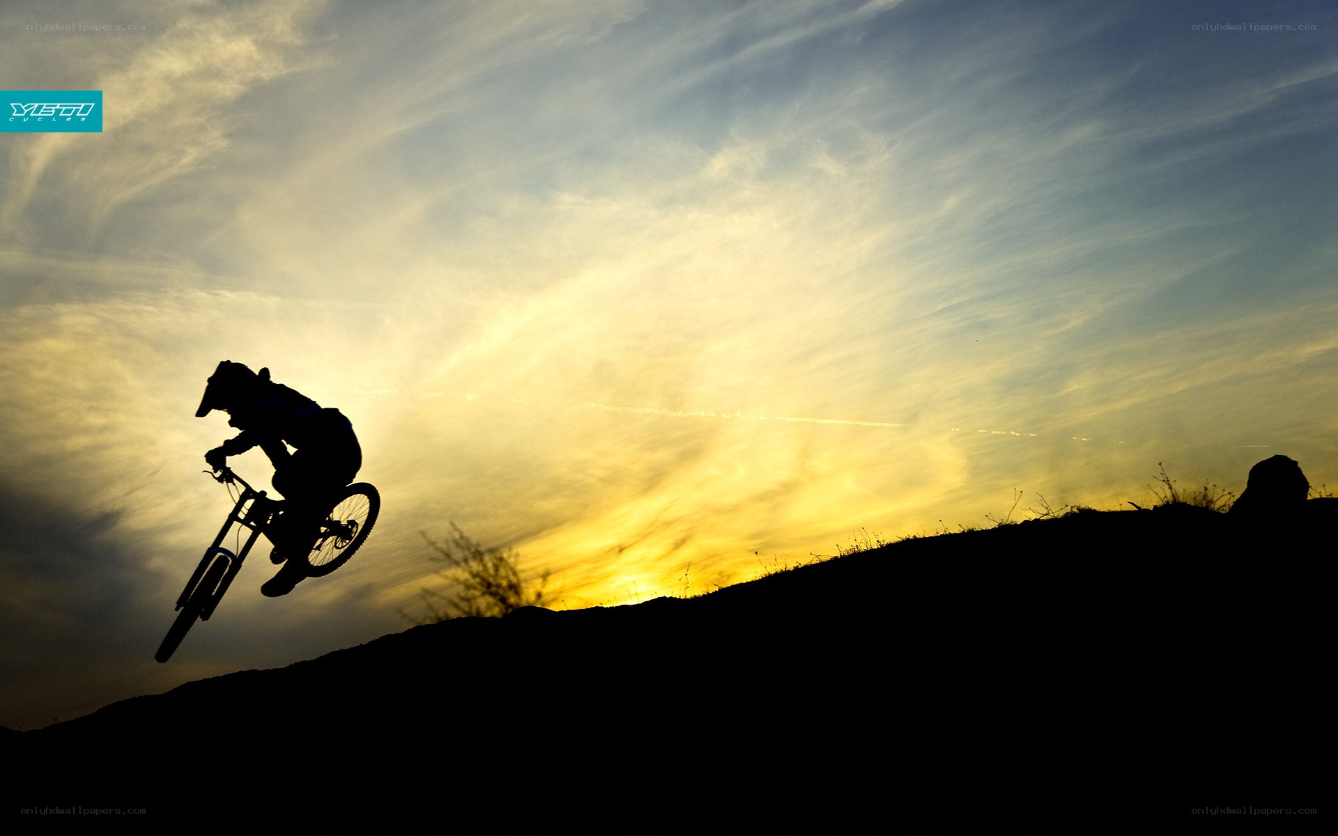 Biker silhouetted at sunset