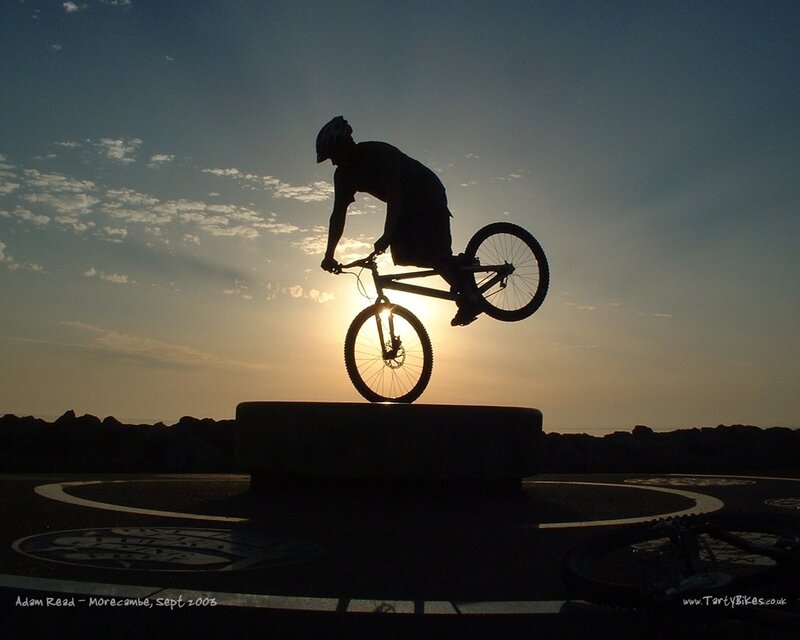Biker silhouetted at sunset