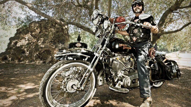 biker with harley-davidson motorcycle