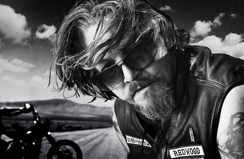 biker with sunglasses on road