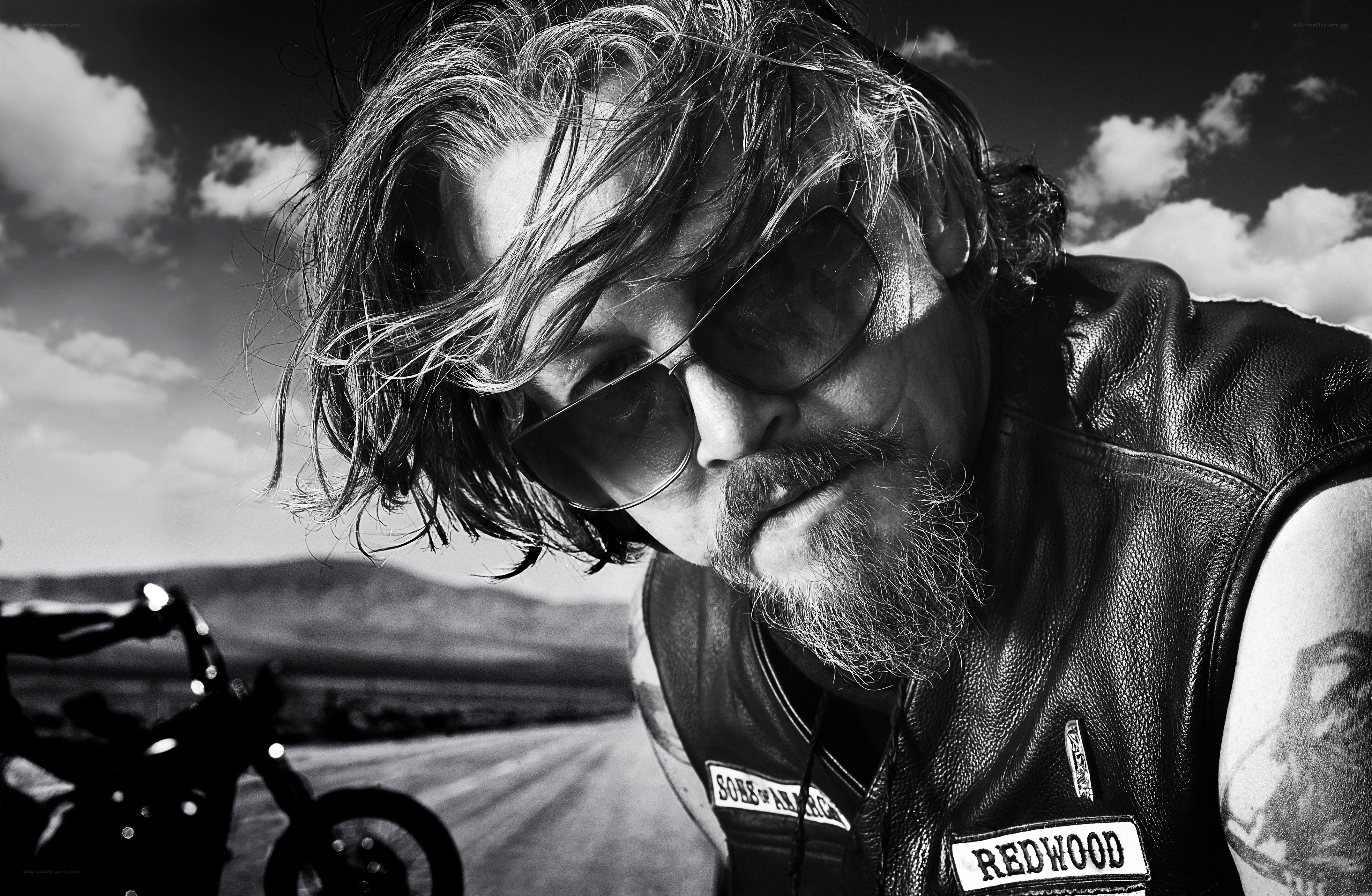 biker with sunglasses on road